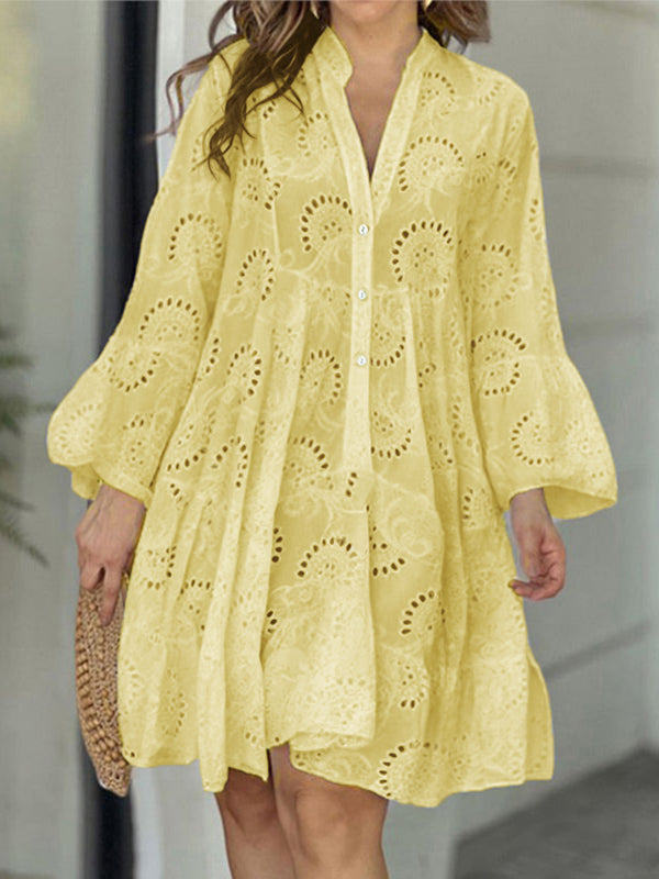 A-line mini dress with V-neck, trumpet sleeves, and button accent