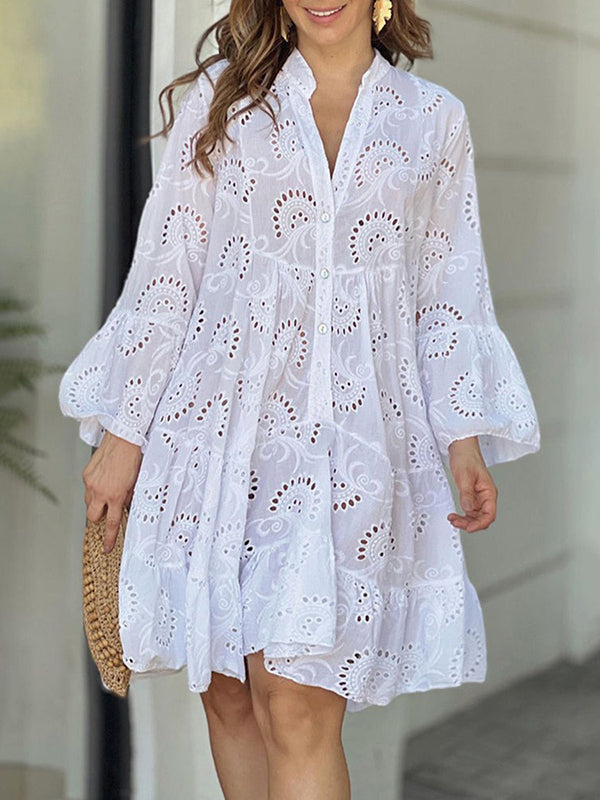 A-line mini dress with V-neck, trumpet sleeves, and button accent