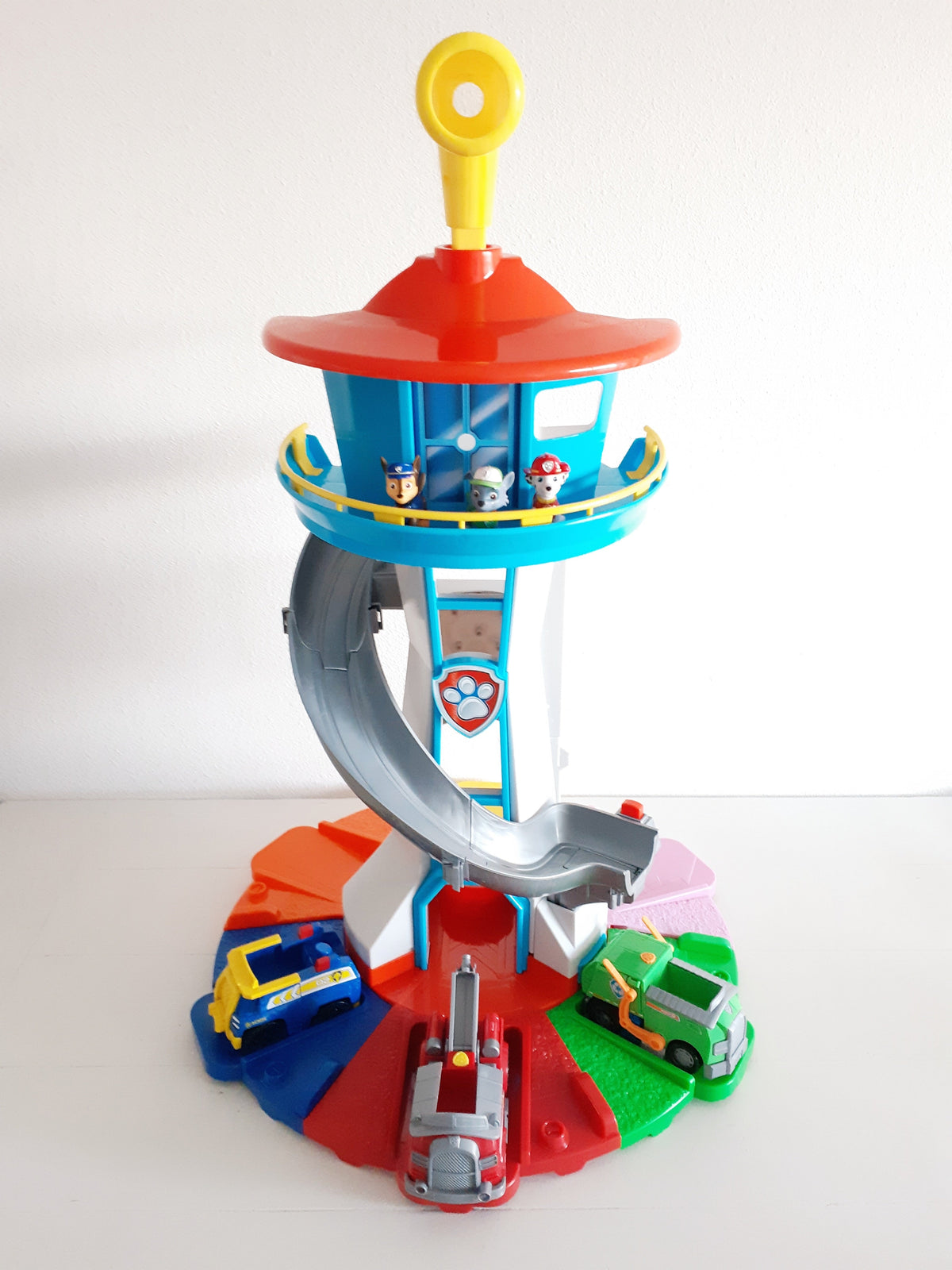 Adventure play tower with slide and racetrack